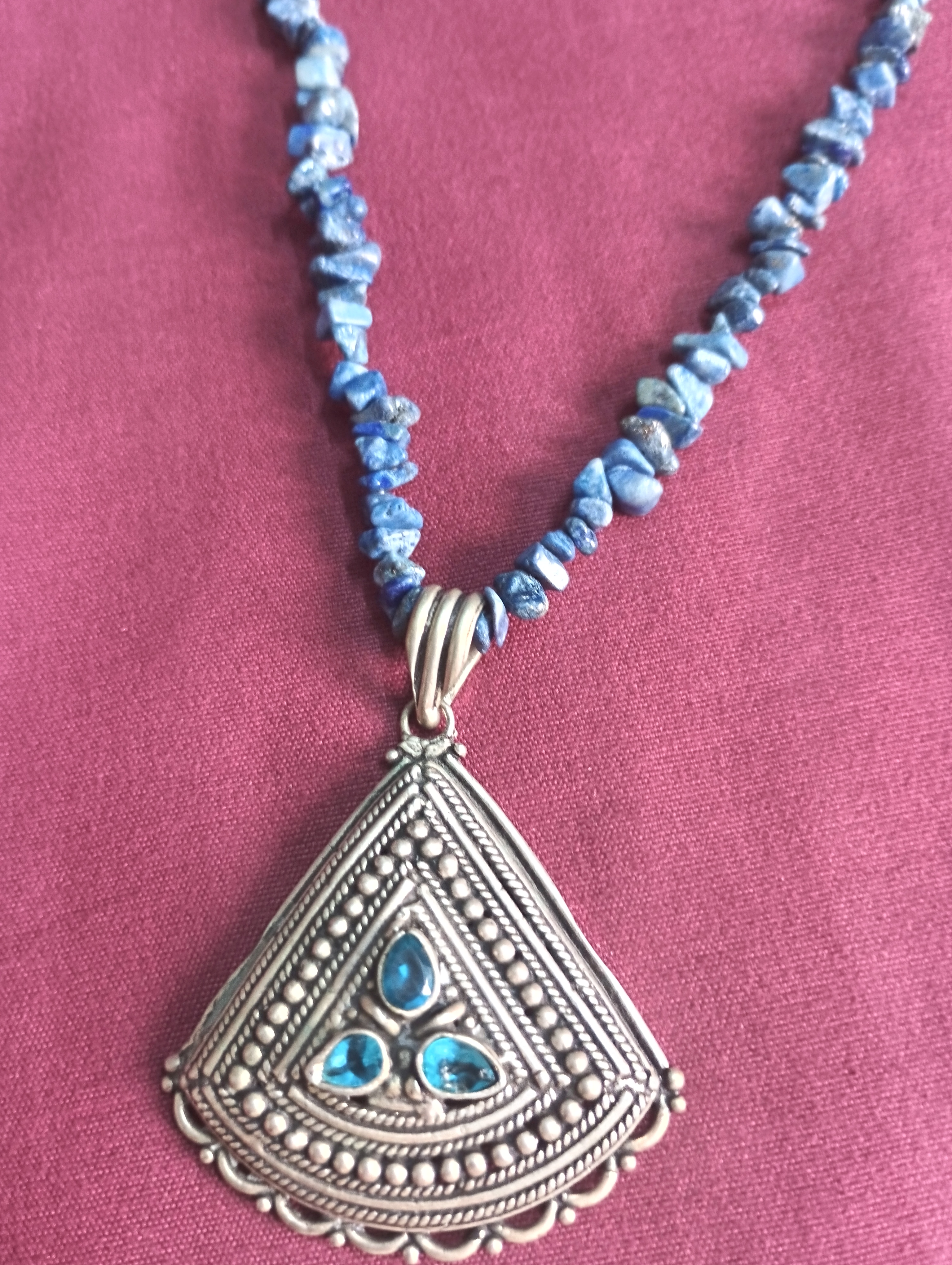 Blue beaded necklace with oxidised pendant