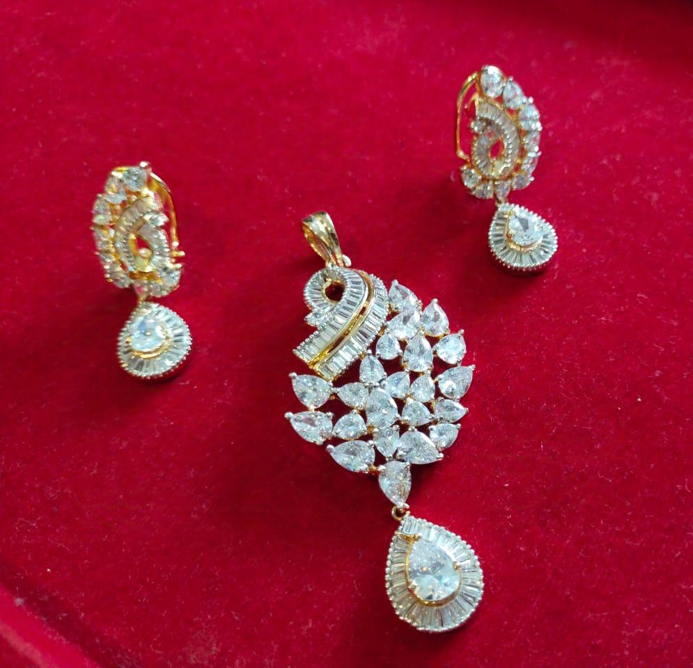 NAYAAB JEWELZ Gold-Plated American Diamond Pendant Set with Matching…